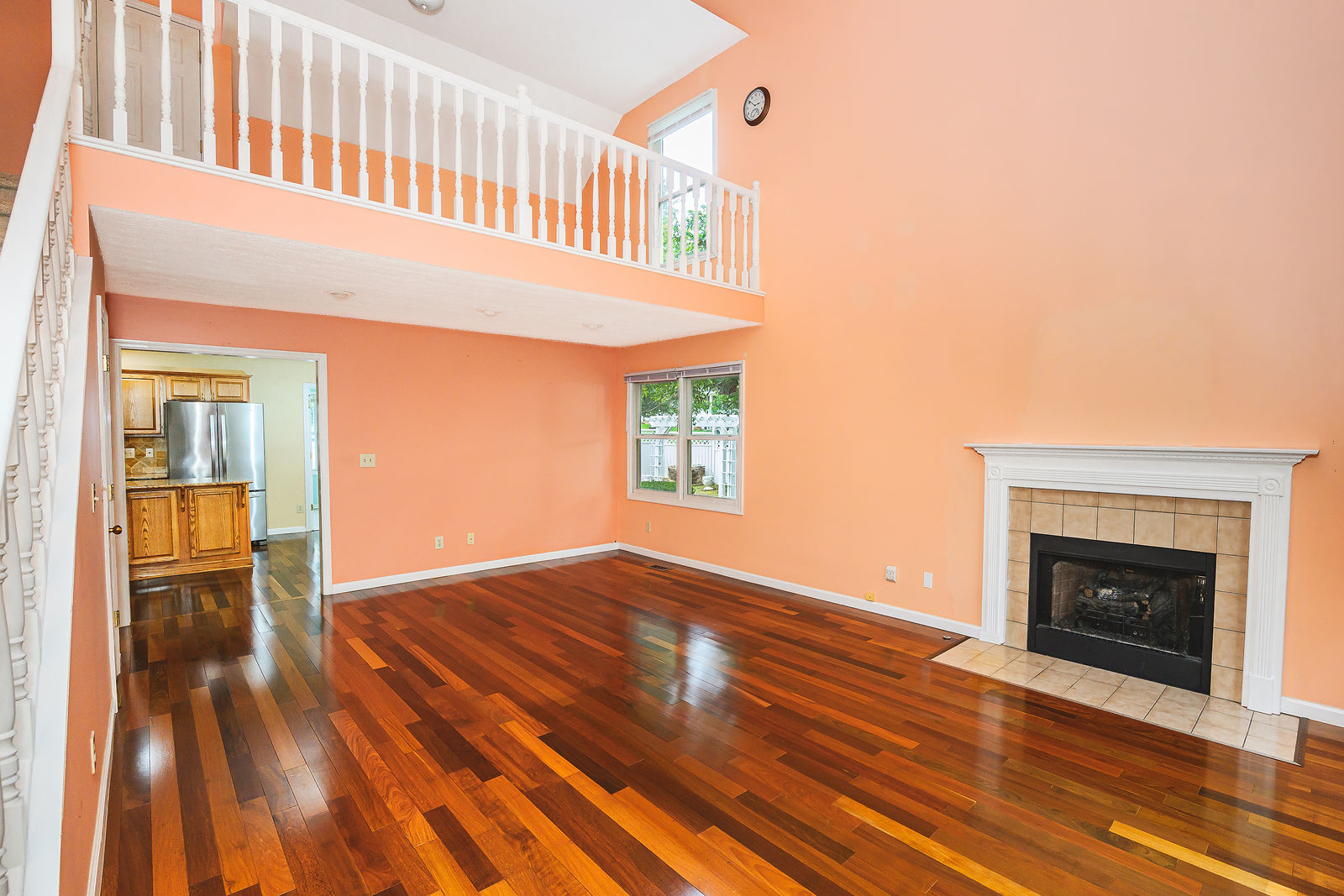 Two-story great room with fireplace and upstairs overlook